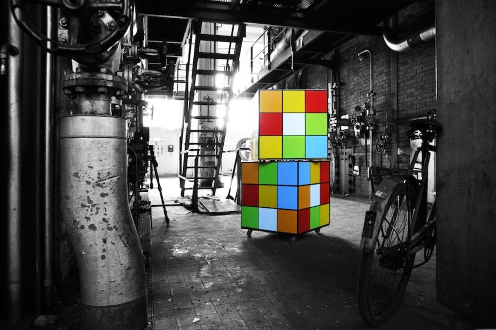 DER EINSTEIN® shelving system installed in a raw industrial space with exposed concrete and steel